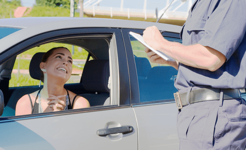 Woman Getting Traffic Violation Ticket
